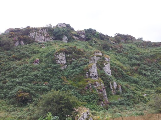 View of St Kevin's Cave and St Kevin's Bed from valley floor